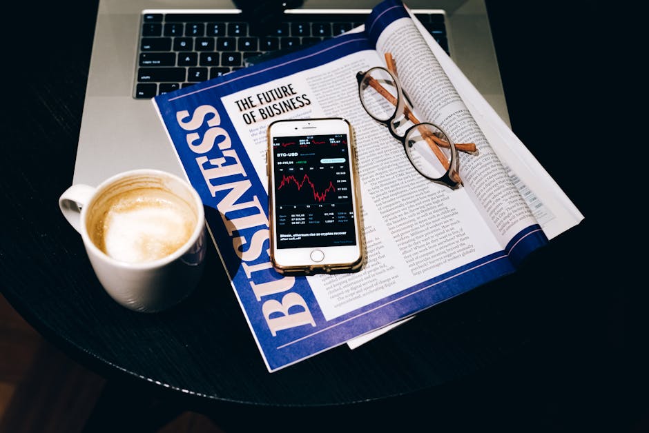 Finance topic research with laptop and papers for documentary ideas