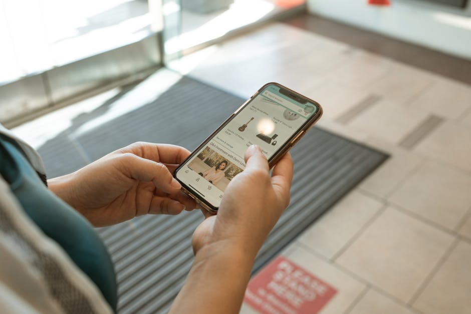 Hands using phone for TikTok Shop affiliate product workflow