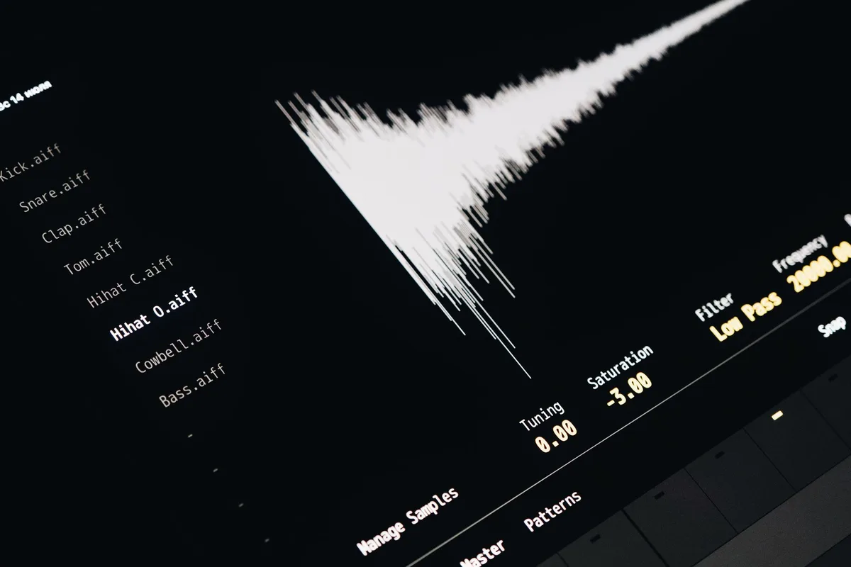 Dark waveform visualization of AI-generated voice audio peaks with teal accent highlights