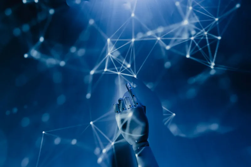 Robotic hand reaching into a digital network on a blue background, representing AI-generated avatar technology in Descript