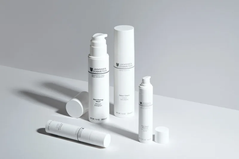 Minimalist skincare bottles on a clean white surface