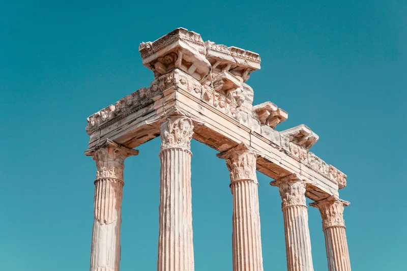 Historic columns of the Temple of Apollo in Antalya under blue sky