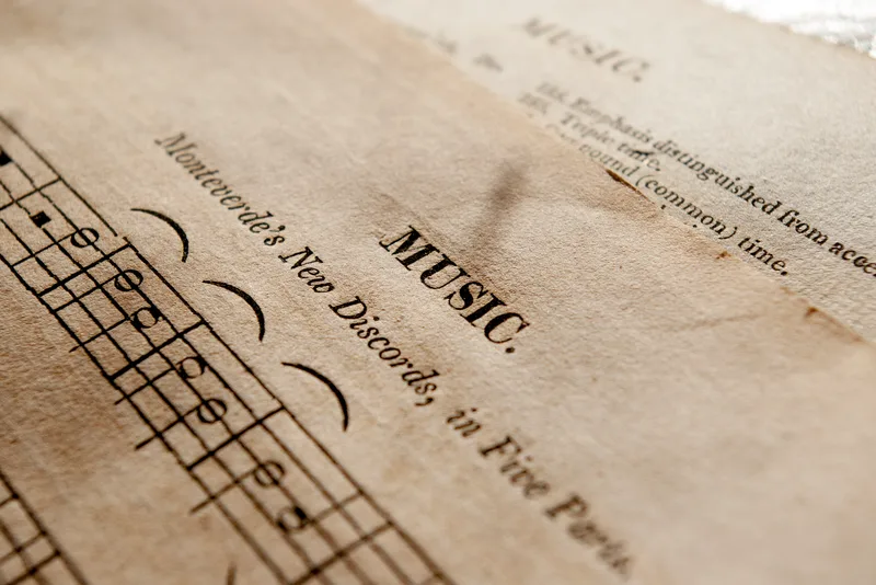 Detailed view of antique music sheets featuring classical notation and musical scores