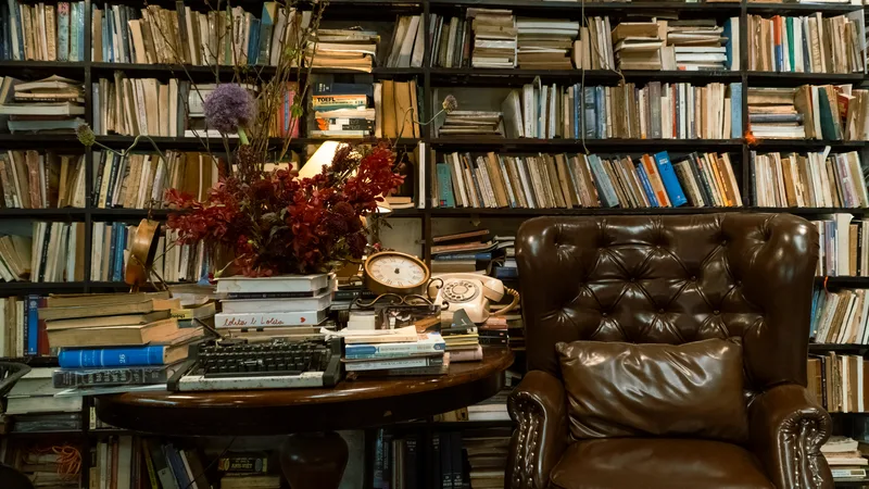 A vintage study room with a leather armchair and bookshelves
