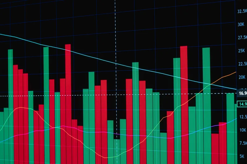 Bar chart with red and green bars showing fluctuating data trends on a dark screen
