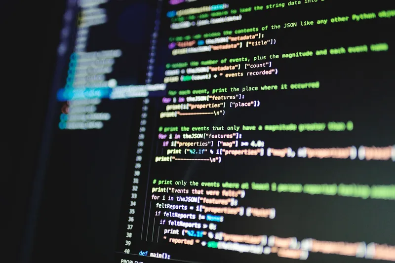 Colorful programming code displayed on a dark computer monitor representing automated video generation pipelines
