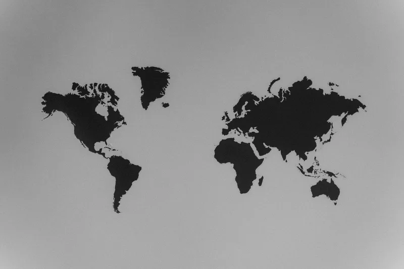 Black and white world map representing global content distribution across 175 languages and markets