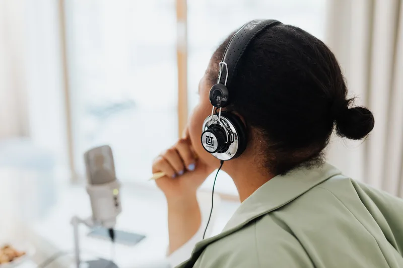 Person wearing headphones listening to audio recording output