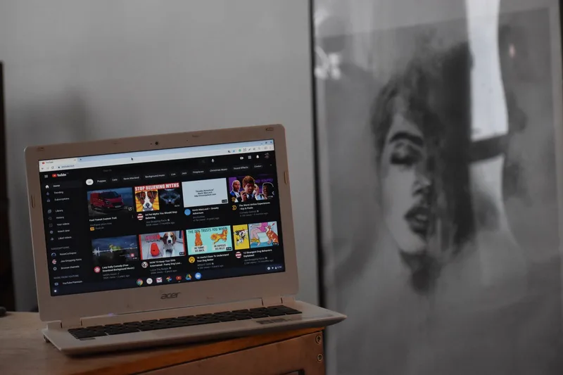 Laptop displaying YouTube website, representing channel management and upload workflow